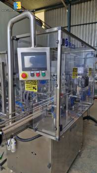 Linha completa de envase com envasadora rotuladora rosqueadora posicionador frascos Tecman Nelpas Tecnoenvase Tudela para l�quidos cosm�ticos